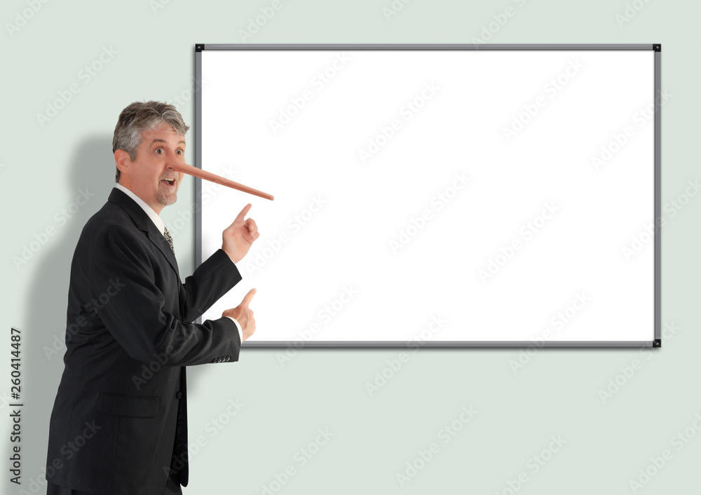 Lying dishonest businessman with growing Pinocchio nose pointing to blank white board