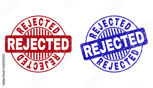 Grunge REJECTED round watermarks isolated on a white background. Round seals with grunge texture in red and blue colors. Vector rubber watermark of REJECTED text inside circle form with stripes.
