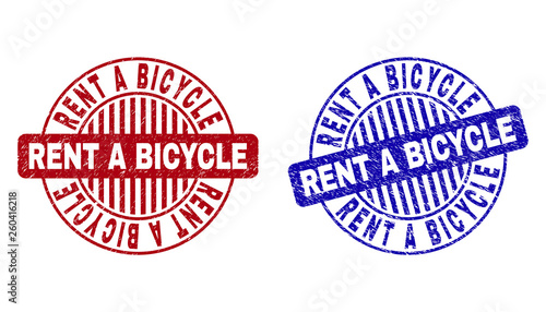 Grunge RENT A BICYCLE round stamp seals isolated on a white background. Round seals with distress texture in red and blue colors.