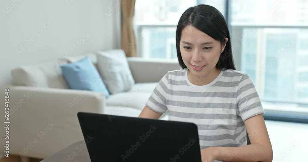 Woman watch on computer at home Woman watch on computer at home
