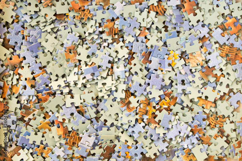 Abstract background of many different puzzles. The concept of teamwork. Abstract background of many different puzzles. The concept of teamwork.