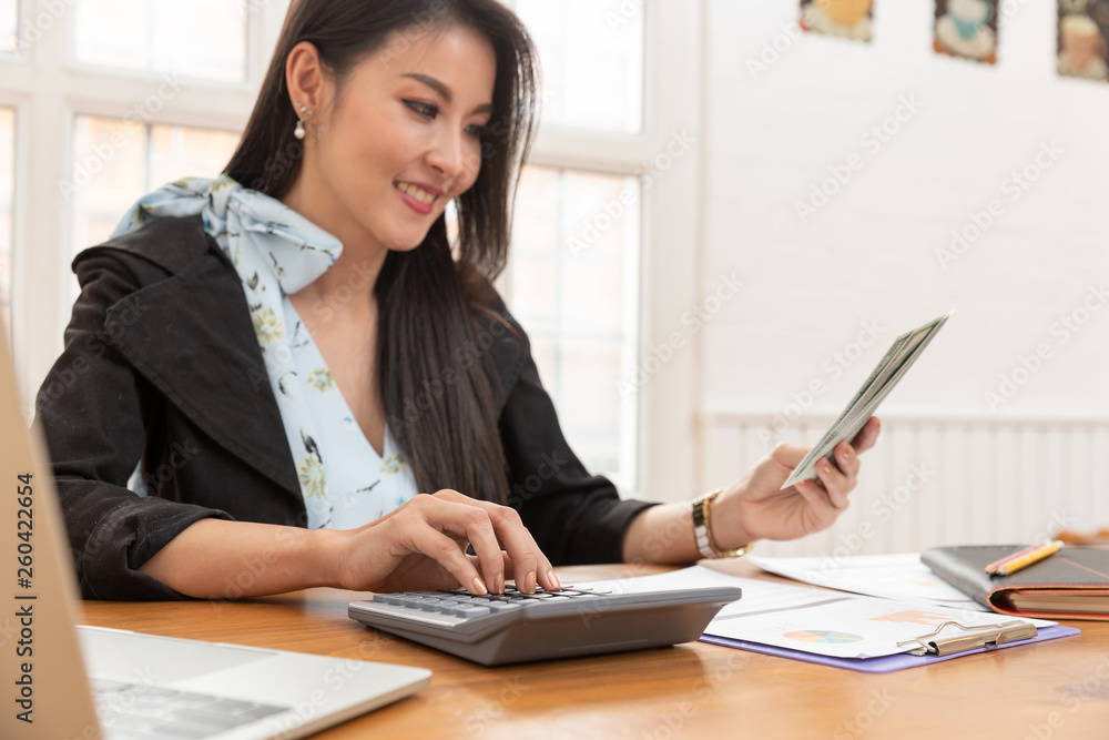 Freelancer business woman working with calculator in cafe. Freelancer business woman working with calculator in cafe.