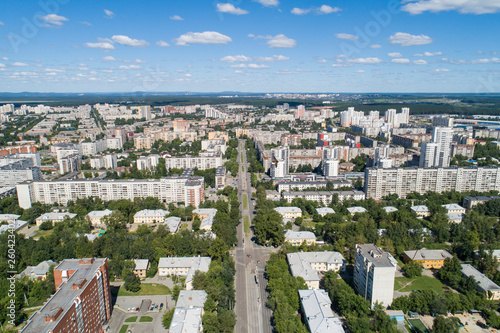 Top down aerial drone image of a Ekaterinburg city in the midst of summer, backyard turf grass and trees lush green. © flyural66