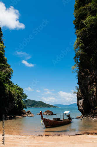 Kayak and Thai wooden longtail boat on the beach, Krabi - Thailand