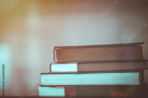Close up stack of book background with selective focus. back to school concept.