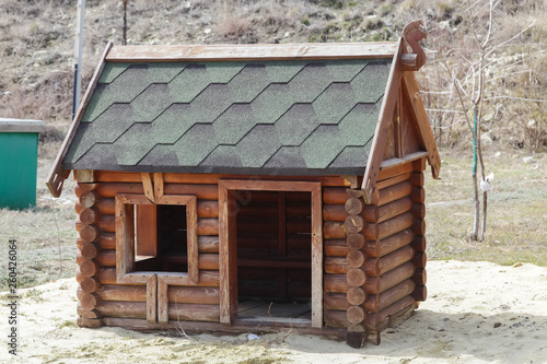 Bilde på lerret Tiny rural wooden bar-shaped house, dog doghouse