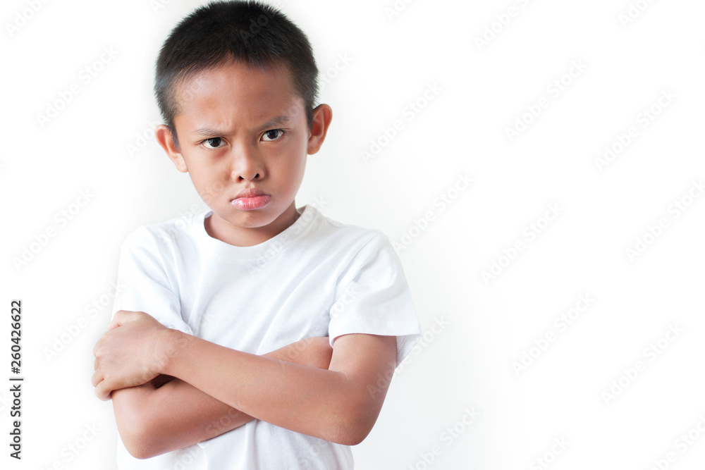 Angry little asian boy isolated on white background.