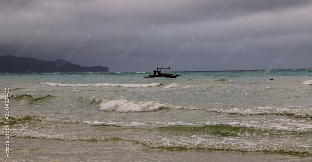Obraz premium Fishing boat on waves 