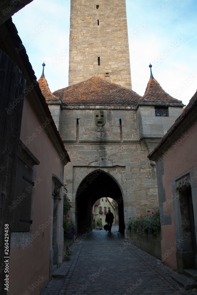 Rothenburg ob der Tauber Germany, cobblestone street and Burgtor or castle gate