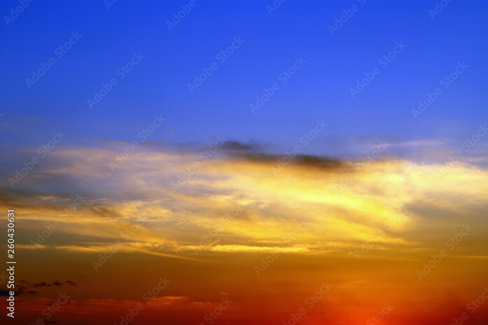 lovely colorful sun colored clouds in the sky for using in design as background.