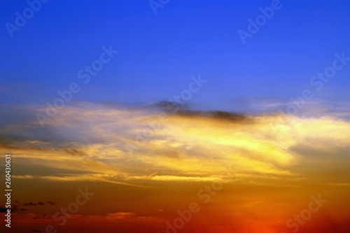 lovely colorful sun colored clouds in the sky for using in design as background.