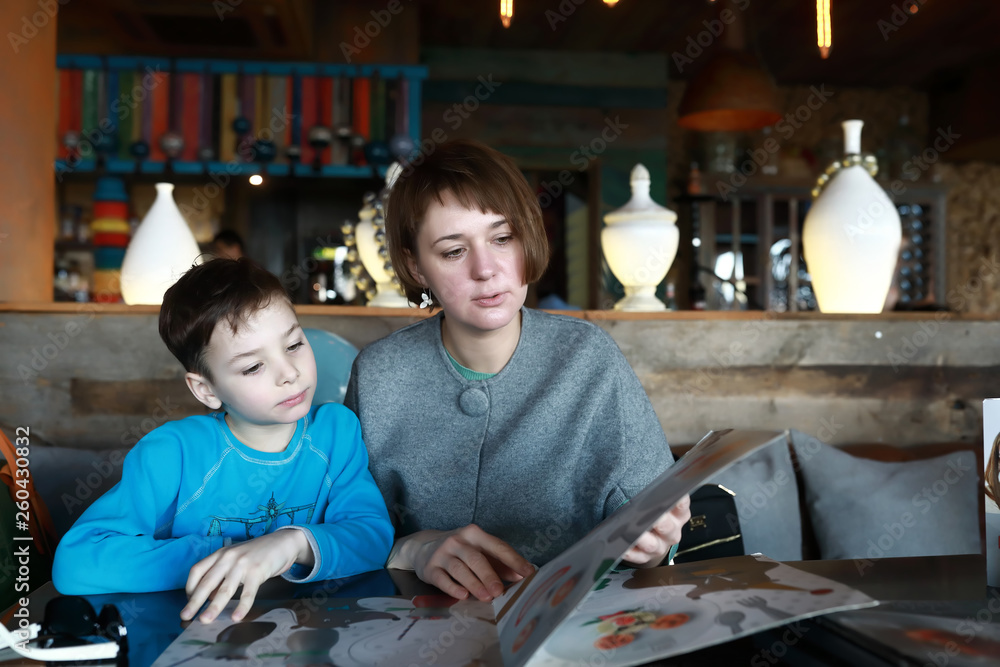 Mother and son with menu Mother and son with menu