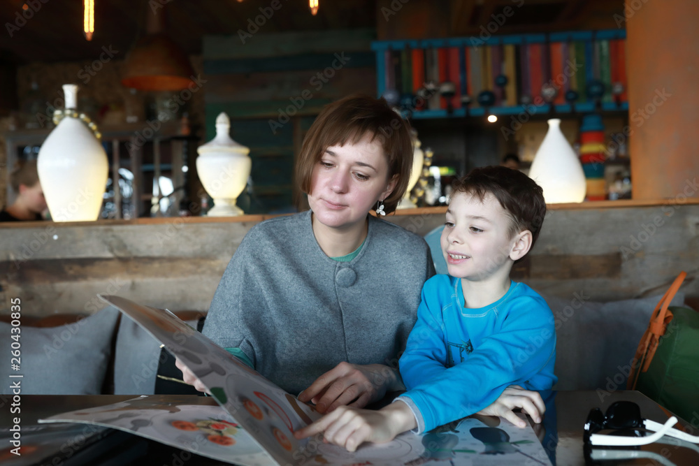 Mother and son choosing dish Mother and son choosing dish