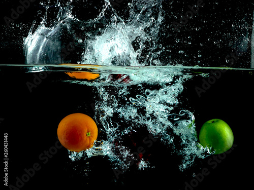 Splashing fruit into water.