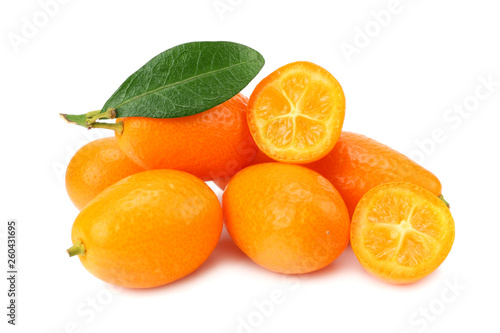 Cumquat or kumquat with slices and leaves isolated on white background