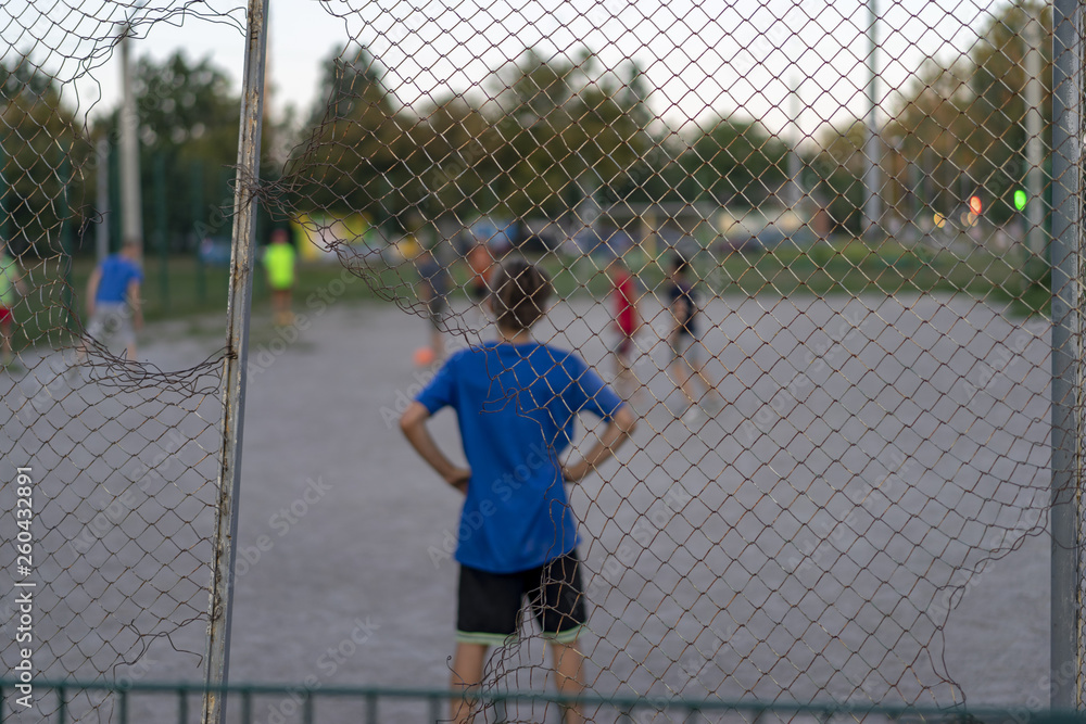 Guys playing football in the yard you will find a grid Guys playing football in the yard you will find a grid