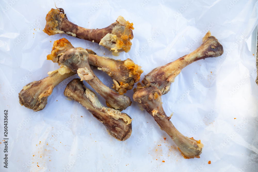 Seven Chicken Bones in Leg with white facial papers in  the box, Abstract background