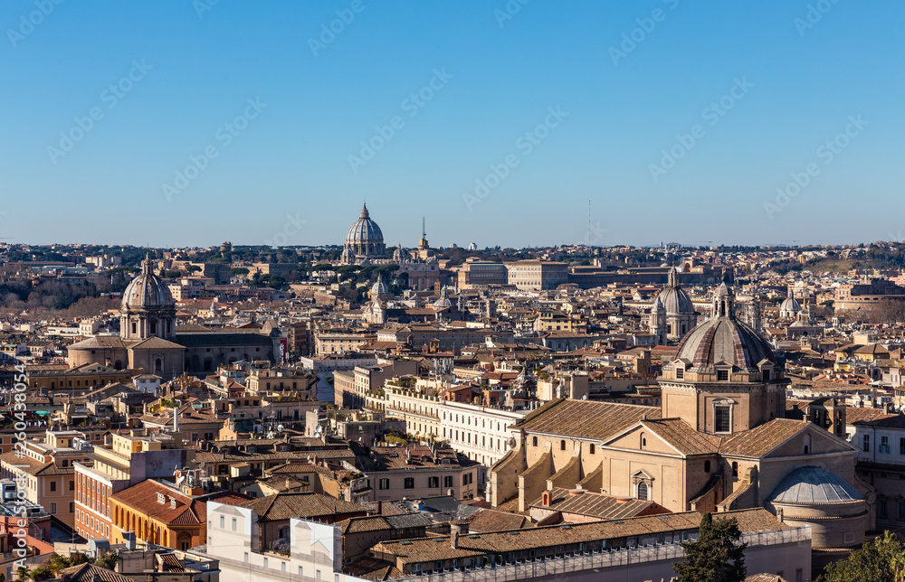 Panoramic sight from the heights with the dome and rooftops of the eternal city in Rome, Italy