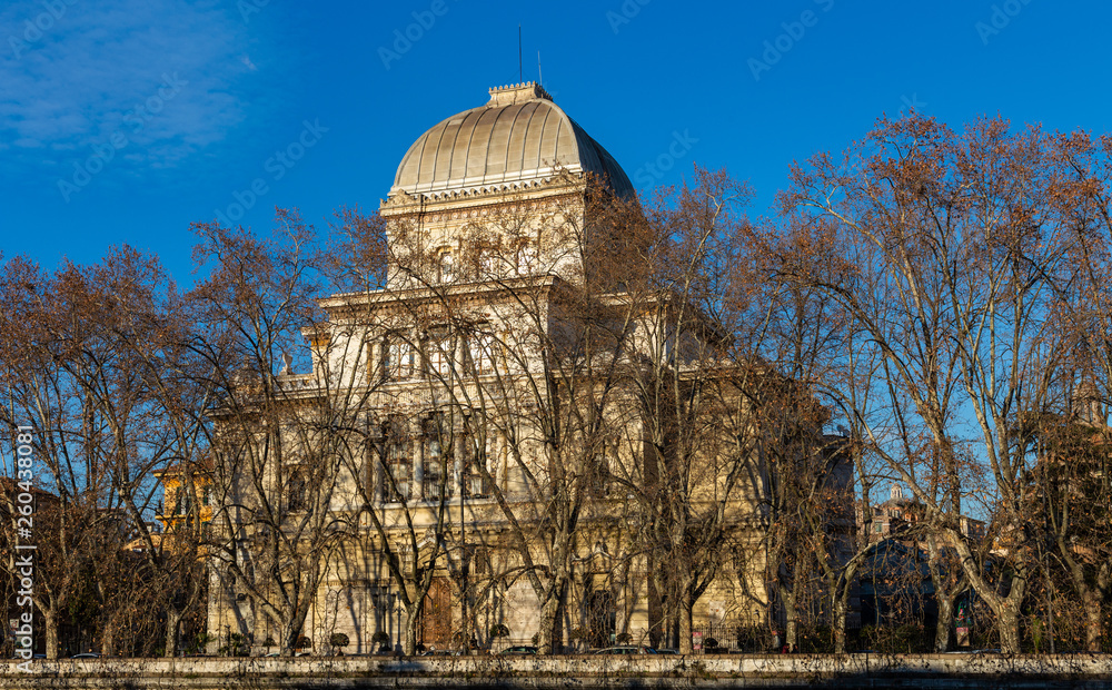 Fototapeta premium Beautiful old building on the embankment of the Tiber river in Rome, Italy