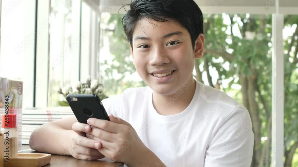 Close up portrait of asian attractive boy smiling confident pretty Close up portrait of asian attractive boy smiling confident pretty