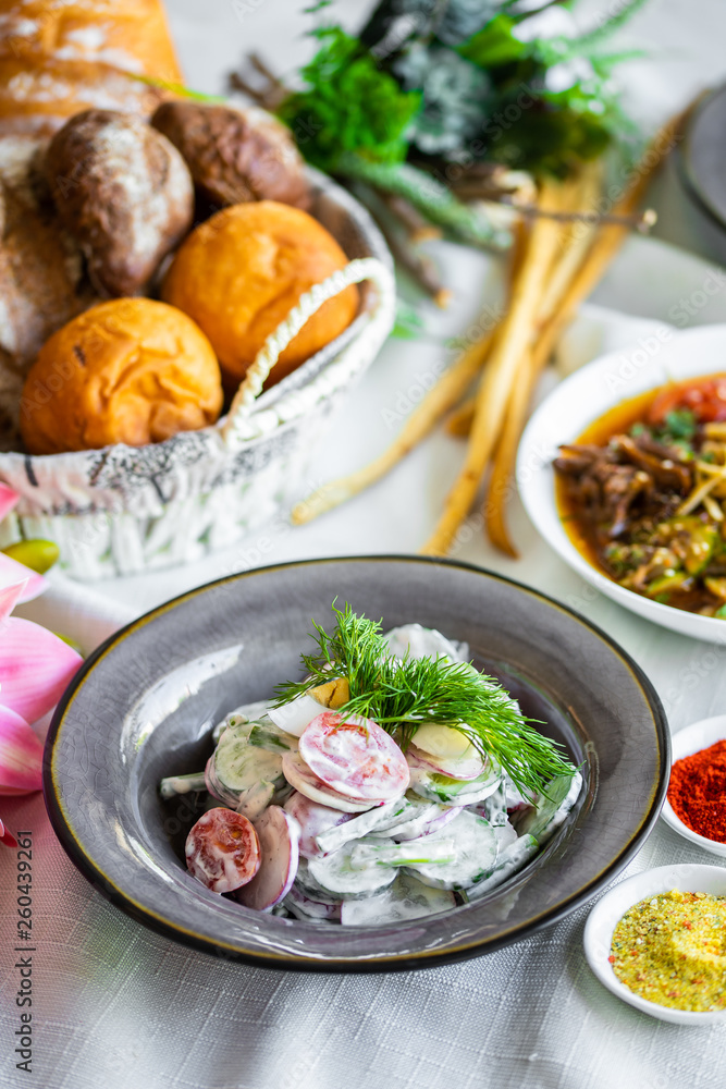 Spring vegetable salad of cucumber radishes, green onions and eggs with mayonnaise. vegetarian salad Spring vegetable salad of cucumber radishes, green onions and eggs with mayonnaise. vegetarian salad