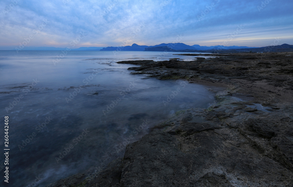 Calm seascape in the evening light on the coast in Crimea