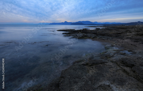 Calm seascape in the evening light on the coast in Crimea