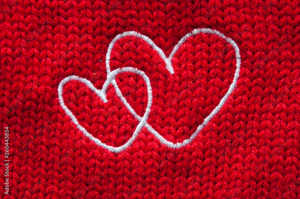 white hearts embroidered handmade with a cross on a red canvas white hearts embroidered handmade with a cross on a red canvas