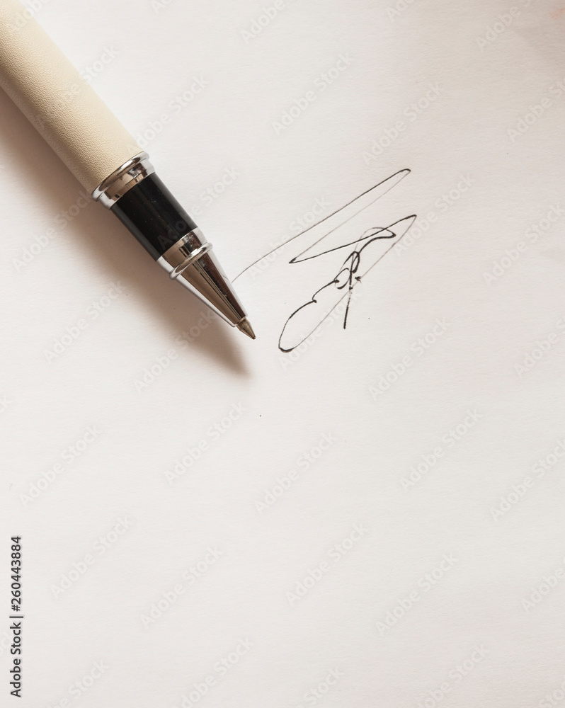 Fototapeta premium pen with signature and document in background