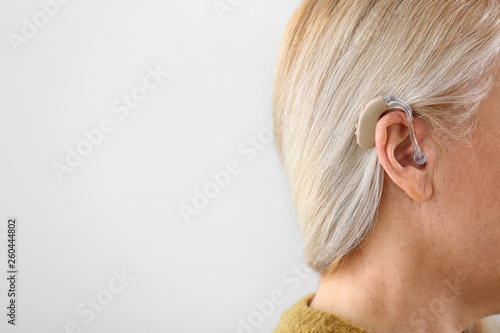 Mature woman with hearing a...