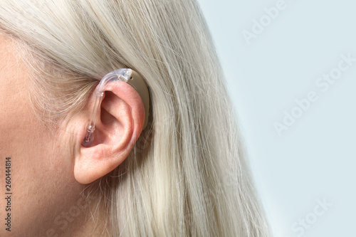 Mature woman with hearing a...