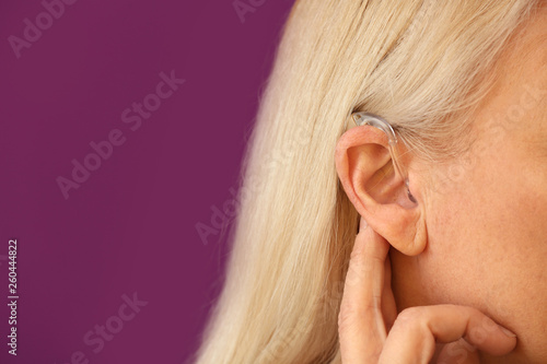 Mature woman with hearing a...