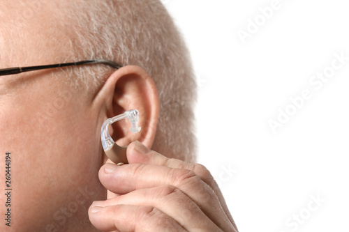 Senior man with hearing aid...