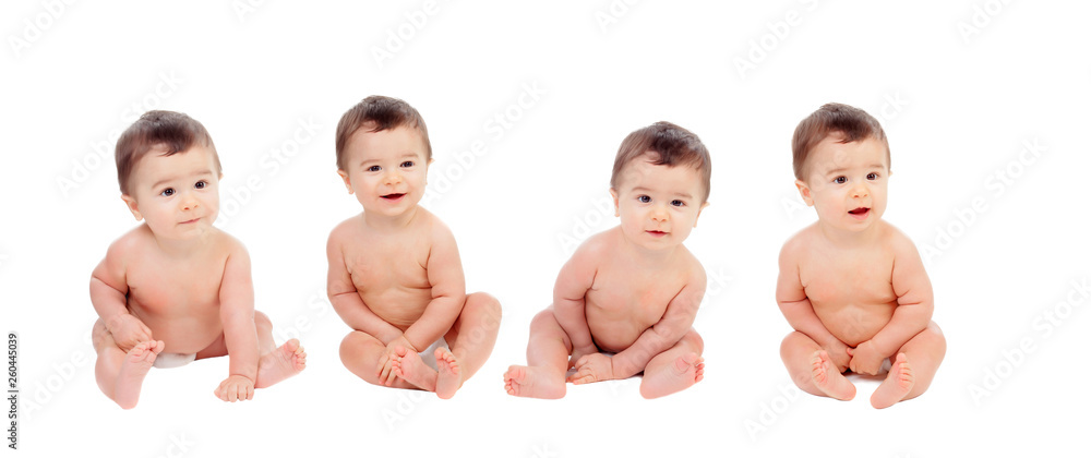 Four equal babies sitting on the floor Four equal babies sitting on the floor