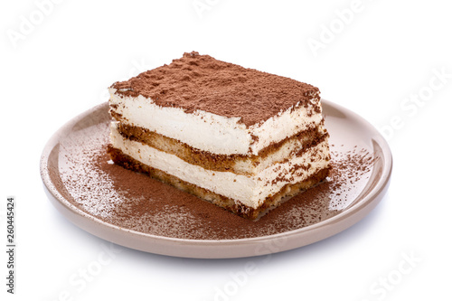 Plate with tasty tiramisu on white background photo