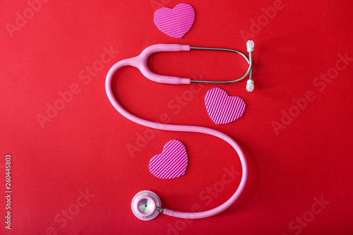 Stethoscope with hearts on color background © Pixel-Shot