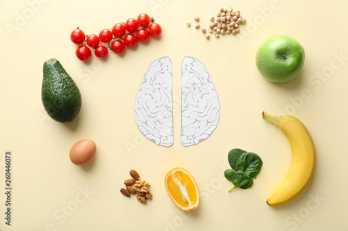 Fototapeta Naklejka Na Ścianę i Meble -  Human brains with different healthy products on color background