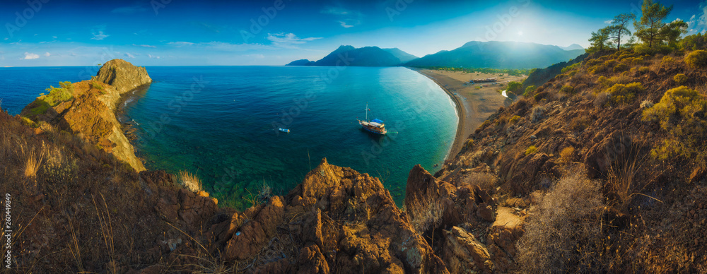 Fototapeta premium Panorama of Cirali beach and Olimpos mountain in a sunset