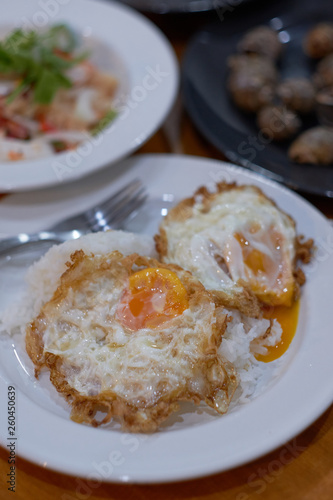 Close up Rice with two fried egg on the white plate