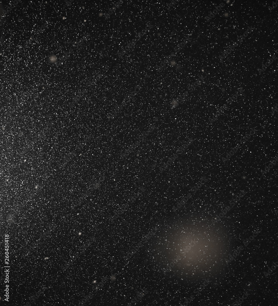 Snow flies in the sky at night as a background Snow flies in the sky at night as a background