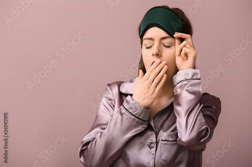 Sleepy woman with mask on c...