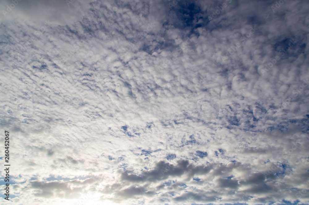 Clouds against the blue sky as a background Clouds against the blue sky as a background