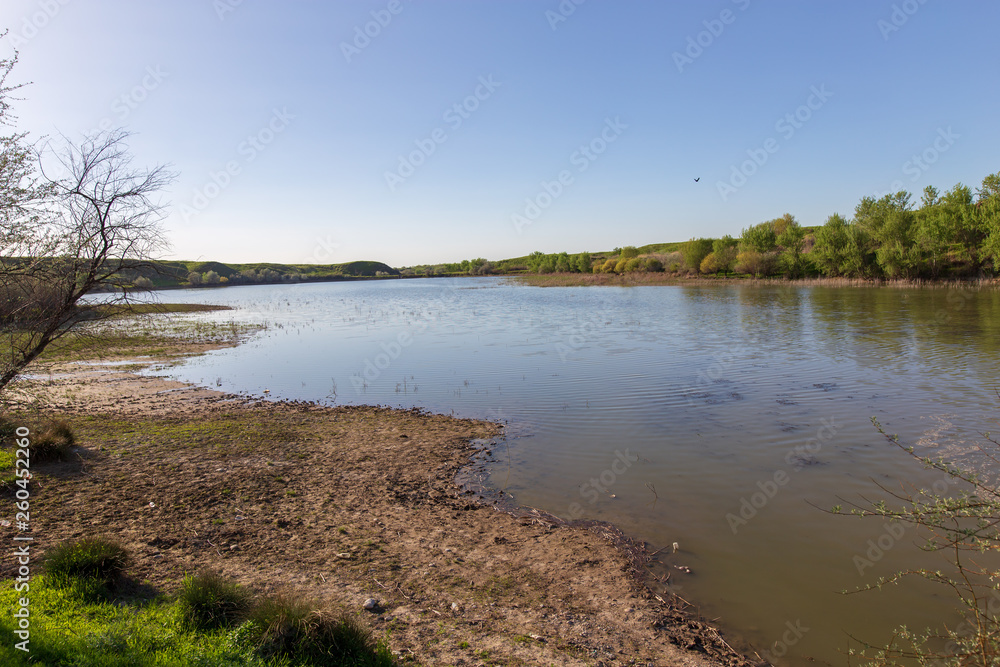 Pond in spring steppe as background