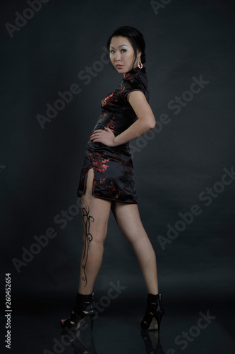 Asian woman with fake drawing tattoo on her leg photo