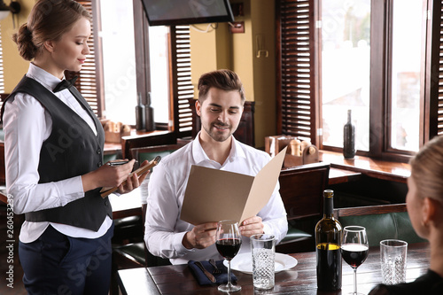 Waiter taking order in rest...