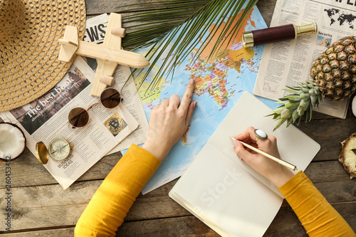 Young woman with world map ...