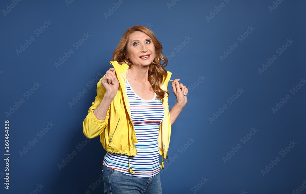 Fashionable mature woman on color background Fashionable mature woman on color background