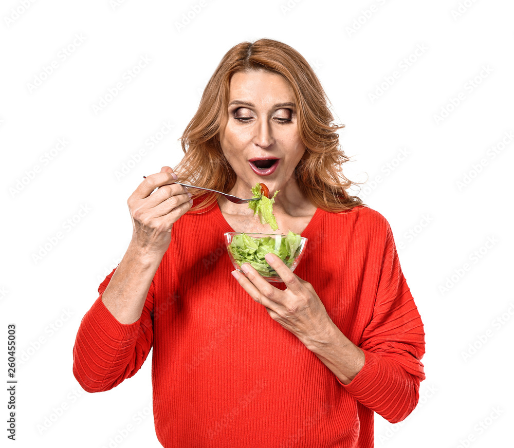 Mature woman with healthy vegetable salad on white background Mature woman with healthy vegetable salad on white background
