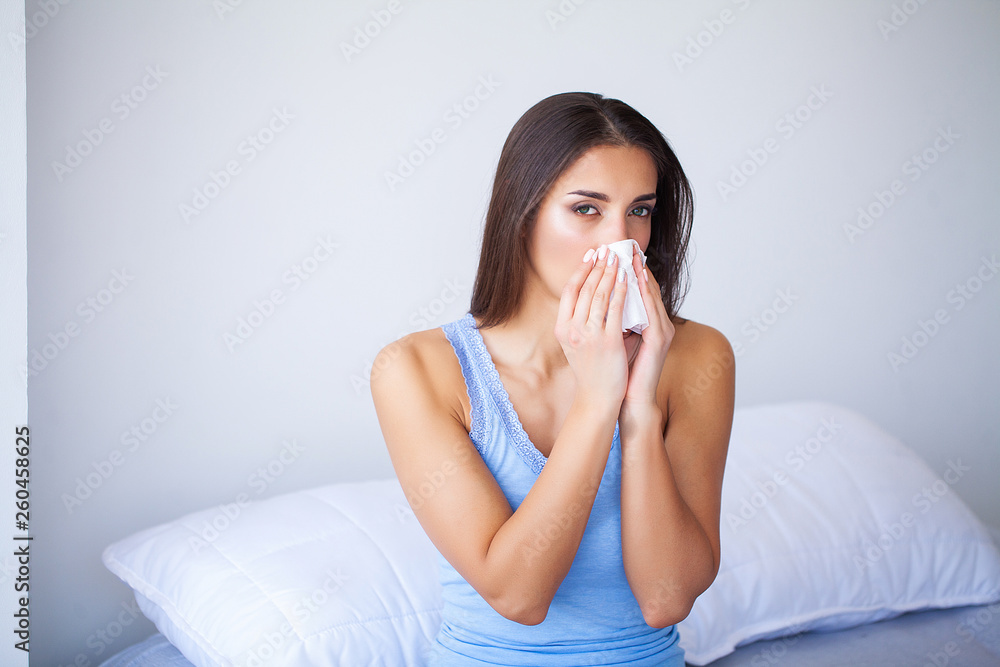 Sick Woman and Flu. Woman Caught Cold. Sneezing into Tissue Sick Woman and Flu. Woman Caught Cold. Sneezing into Tissue