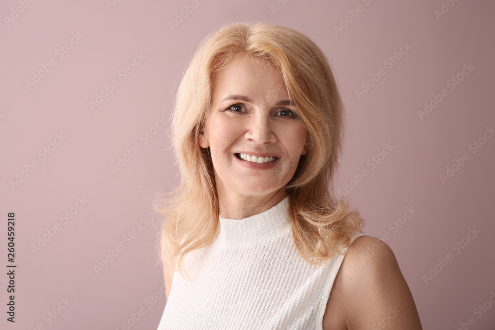 Stylish mature woman on color background Stylish mature woman on color background